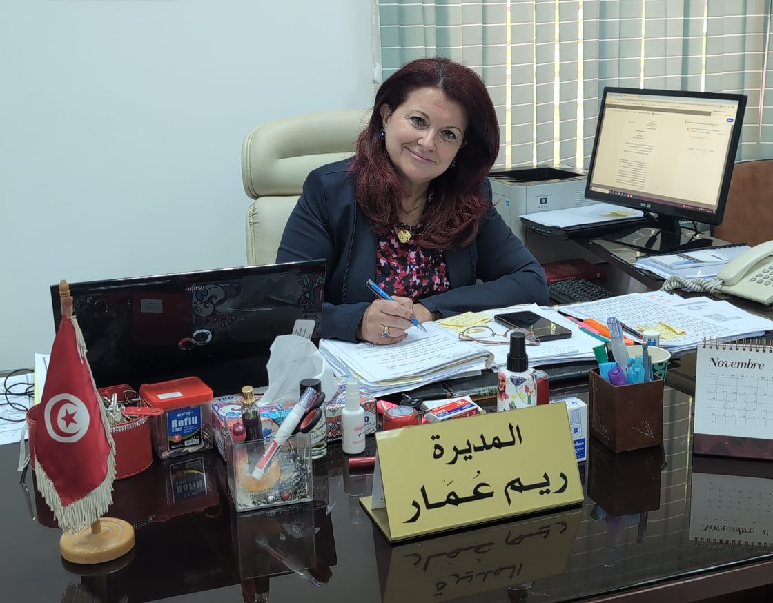 Rym Omar at her desk in the director's office