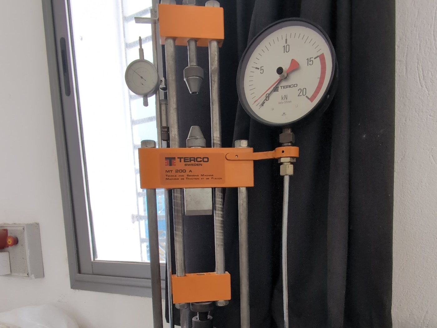 A tensile and bending testing machine with its pressure gauge